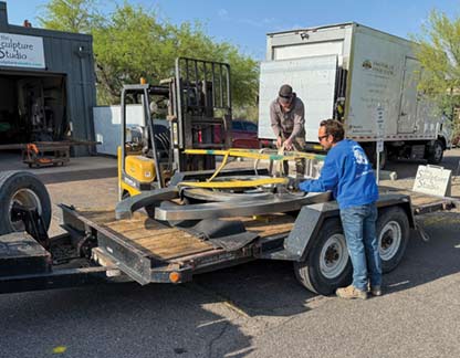 Loading sculpture on trailer